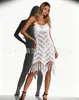 Vestido de punto calado con flecos estilo europeo y americano, vestido de playa de ganchillo transparente y femenino, perfecto para llevar sobre un vestido de vacaciones