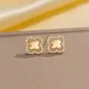 Pendientes de cobre con incrustaciones de diamantes, los más vendidos transfronterizos europeos y americanos, pendientes de botón exquisitos y únicos de celebridad de internet retro para mujer, versátiles y de alta gama