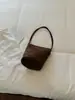 Bolsa balde da moda de outono nova para mulheres, bolsa de ombro tendência estilo coreano de nicho, bolsa de mão de camurça vintage para o dia a dia