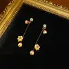 Estilo Francês Leve Luxo Banhado a Cobre Ouro Brilhante 18K Botão de Flor Fofo Longo Borla Brincos de Flor Exquisitos Nicho Elegante e Luxuoso