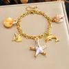 Joyería Popular de AliExpress Serie Oceánica Colgante Pulsera Moda Acero Inoxidable Chapado en Oro Multi-Elemento Estilo Playa Accesorio de Mano