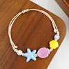 Jingdezhen Navidad Pulsera de Cuerda Trenzada de Cerámica Pulsera de Trébol de Cuatro Hojas Joyería Artística Hecha a Mano Venta al por Mayor Pulseras de Cerámica para Atracciones Turísticas