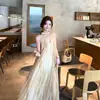 Vestido slip sin mangas de cuello halter en V para mujer, estilo francés de verano, puro y seductor, estilo vacacional en la playa, vestido largo transparente de línea A