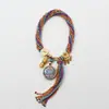 Cuerda de mano tejida a mano thangka de Xizang ocho santos patrones thangka cuerda de mano tejida a mano cuerda de mano de hilo de algodón multicolor marea nacional