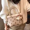 Bolso de gamuza para mujer 2026 nuevo otoño vintage bolso de mano para el día a día con un toque de alta gama, bolso tipo cubo de un solo hombro cruzado