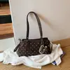 Bolso de mujer de diseño nicho 2026 nuevo bolso de hombro cruzado de verano versión coreana ins bolso de mano de lunares bolso tote