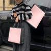 Bolsa no tejida con recubrimiento en polvo color glaciar portátil material nuevo LOGO tienda de ropa bolsa para ropa mujer alta gama simple