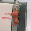 Pingente de Bolsa Fofo de Cachorrinho Snoopy Celebridade da Internet, Chaveiro de Carro Feminino, Ornamento Feito à Mão, Presente para Casal Venda por Atacado