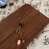 Collar de Cuerda Trenzada con Borla de Anillo de Madera Bohemio Cadena de Suéter Tejida a Mano Zen Antigua Accesorios de Nicho Personalizados