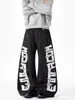 Pantalones Negros Transfronterizos con Estampado de Letras Estilo Americano, Costuras Visibles, Parches Desconstruidos, Corte Holgado, Pantalones Largos Únicos Estilo Urbano