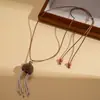 Estilo Étnico Europeo y Americano Cadena de Suéter con Borla de Perla Artificial Núcleo de Fruta de Cerámica Moda Retro Personalidad Nicho Collar de Gama Alta