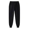 18 colores pantalones casuales para hombre color liso pantalones largos juveniles modernos tiro medio pantalones deportivos pants de chándal en stock blanco