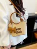 Venta al por mayor transfronteriza de bolsos nuevos tejidos a mano, bolsos de moda nuevos 2026, bolsos tipo cubo para mujer, bolsos de hombro y cruzados de alta gama