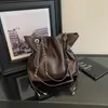Bolsos transfronterizos de moda 2026 nuevos bolsos de hombro con cadena otoño/invierno bolsos cruzados tipo cubo de moda nicho