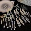 Aretes de borla de circonio de garra de alta calidad con aguja de plata 925 para mujer, temperamento de nicho de lujo ligero, aretes largos, aretes adelgazantes para rostro redondo
