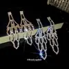 Aretes de Aguja Plateada con Borlas Redondas Huecas Incrustadas de Diamantes, Estilo Europeo y Americano, Diseño Minimalista, Lujo Ligero, Aretes de Alta Gama