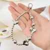 Ins Coreano Nuevo Dulce Chica Perla Lazo Plata Amor Colgante Llavero Auriculares Bluetooth Colgante