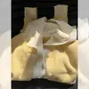 Cárdigan de punto con capucha gris estilo francés de dos piezas falsas para mujer, prenda exterior de principios de otoño con un toque de alta gama, abrigo holgado suave y mullido