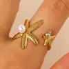 Anel de Aço Inoxidável com Pérola de Zircônia Estilo Oceano Cruzado Europeu e Americano Anel de Estrela do Mar Concha Búzio Joia de Mão Elegante para Mulheres