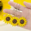 Llavero de Girasol Llavero Sonriente Joyería Accesorios Lindos para Bolsos Venta al por Mayor Colgante de Girasol Puesto Transfronterizo