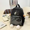 Mochila nueva y linda de dibujos animados para mujer, mochila transparente de moda con bloques de color, bolsa ligera versátil para exteriores y escuela casual