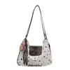 Bolsa de Mujer Linda de Dibujos Animados 2025 Nuevo Otoño e Invierno Retro Gran Capacidad Hombro Viajero Lunares Moderna Bolso Tote Versátil