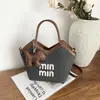 Bolsa tote de gran capacidad para mujer, nueva moda 2026, bolsa versátil de bloques de color para llevar debajo del brazo, bolso de hombro casual para la escuela y el trabajo, moderno