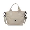 Bolso tote pequeño portátil de estilo ins japonés y coreano, bolso de mano ligero, bolso de hombro y cruzado para mujer, bolsa casual diaria para teléfono