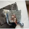 Bolsa Casual de Tela de Nylon para Mujer Estilo Coreano 2025 Nueva Moda Bolso de Mano Ligero Bolso Cubo de Hombro Cruzado Literario