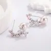 Brincos de Laço Francês com Pérola Rosa de Imitação para Mulheres 2026 Novo Popular Design de Nicho Brincos Modernos e Elegantes