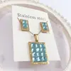 Nuevo especial transfronterizo explosión de tendencia europea y americana titanio acero alta calidad color collar pendientes traje femenino joyería de concha real