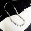 Collar de acero inoxidable con giro europeo y americano, pulsera de trenzado cruzado, cadena para clavícula de hoja trenzada tricolor de acero de titanio