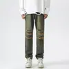 Jeans retos masculinos estilo retro americano de rua, tingidos em amarelo terra, lavados, calças Maillard slim-fit da moda