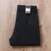 Estación europea de alta gama pantalones casuales color caqui para hombre verano finos de nailon antiarrugas elásticos transpirables rectos holgados