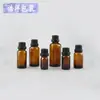 Botella de aceite esencial de vidrio marrón con tapa de cabeza grande de 5ml-50ml, tapa a prueba de manipulaciones, botella a prueba de luz, el aceite esencial se divide en botellas y se moldea
