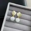 Pendientes de ojo de gato de alta gama con temperamento para mujer, modernos, colgantes para oreja, rombo, lujosos, elegantes, joyería pequeña para la oreja estilo Chanel, pendientes de botón