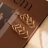 Pendientes Geométricos de Rombo Hueco Estilo Transfronterizo Europeo y Americano con Diseño de Tres Capas Envolvente, Accesorios para Orejas de Nicho Modernos y Minimalistas