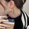 Pendientes de aro grandes con hebilla de oreja de círculo retorcido dorado, ligeros, de lujo, de metal, combinables con todo, a la moda para mujer.