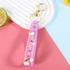 Silicona brillo transparente sol arcoíris cuerda de cuero Muñeco de dibujos animados Muñeco accesorios cadena de llavero colgante correa de mano venta al por mayor