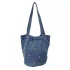 Bolso cubo de mezclilla lavada transfronterizo de alta gama nicho para commuting gran capacidad bordado simple bolso de hombro para mujer