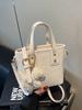 Bolso pequeño súper hot transfronterizo para mujer primavera y verano 2025 nuevo bolso bandolera de moda este año explosiones populares bolso de cubo portátil
