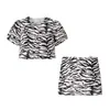2025 Verano Nuevo Moda Callejera Femenina Europea y Americana Conjunto de Top con Estampado Animal + Falda Corta 2725 Poliéster