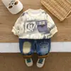 Conjunto de Ropa de Primavera para Niños 2026 Nuevo Conjunto de Dos Piezas Casual con Estampado de Letras para Niños Sudadera de Manga Larga Ropa Moderna de Primavera y Otoño