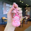 Llavero acrílico con forma de botella de arenas movedizas en aceite, regalo al por mayor, colgante de muñeca de donut, lindo llavero de arenas movedizas.