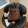 Bolso de cubo de cadena con patrón de diamantes versátil de nicho de moda retro coreana 2026 nuevo modelo bolso de hombro cruzado de alta gama