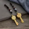 Colgante de llave de bóveda abierta con lingote de pez doble del zodíaco de imitación de latón, colgante de cuerda de nube auspiciosa de los doce zodíacos, venta al por mayor