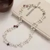 Colección Larga de Collares Superpuestos de Perlas Swarovski para Mujer, Estilo Lujo Ligero, Cadena Versátil para Suéter con un Toque de Alta Gama, Venta al por Mayor Otoño e Invierno