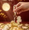 Venta Caliente Año del Cordero Tener Dinero para Gastar Llavero Dorado Oro Puro 999 Correa para Teléfono Colgante de Bolso Empaque de Caja de Regalo Regalo para Conducir