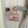 Bolsa Kelly estilo coreano simples 2026 novo modelo fecho de metal de alta qualidade requintado bolsa de mão de moda ombro transversal pequena quadrada para mulheres