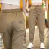 Calça Casual de Seda Gelada para Trabalho Masculina Solta Jogger de Verão Fina de Secagem Rápida Nova Calça Esportiva de Nove Pontos